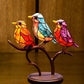 Dekoratives Ornament – Vögel, die auf einem Ast sitzen 